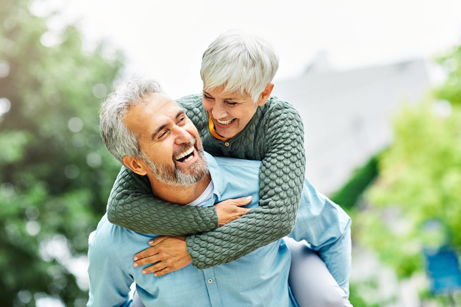 An older couple laughing together